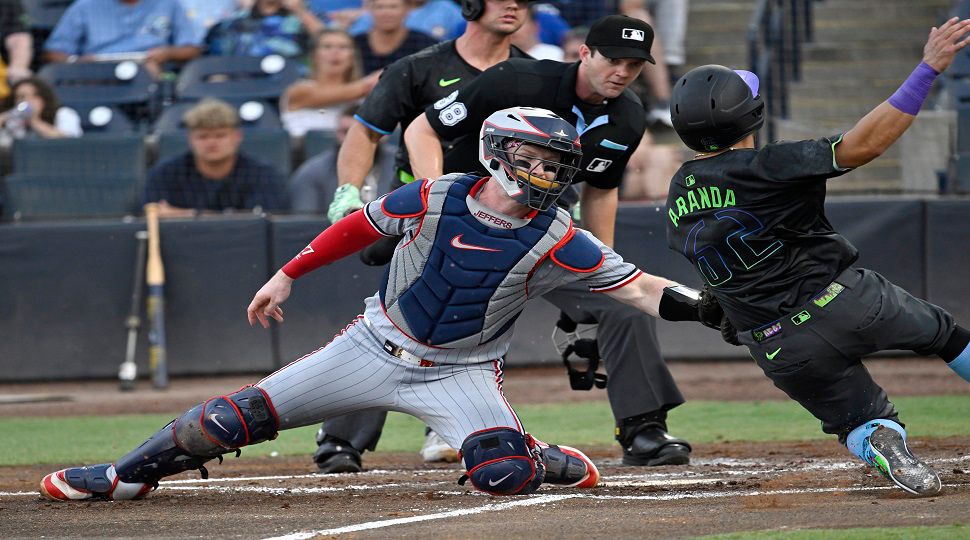 Minnesota Twins catcher Ryan Jeffers tags out Tampa Bay Rays' Jonathan Aranda (62) as Aranda trys to steal home during the second inning of a baseball game Tuesday, May 27, 2025, in Tampa, Fla. (AP Photo/Jason Behnken)