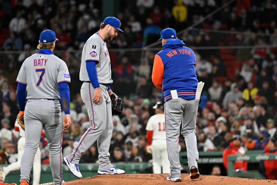 May 21, 2025; Boston, Massachusetts, USA; New York Mets manager Carlos Mendoza (64) relives starting pitcher Tylor Megill (38) during the fifth inning against the Boston Red Sox at Fenway Park. Mandatory Credit: Eric Canha-Imagn Images