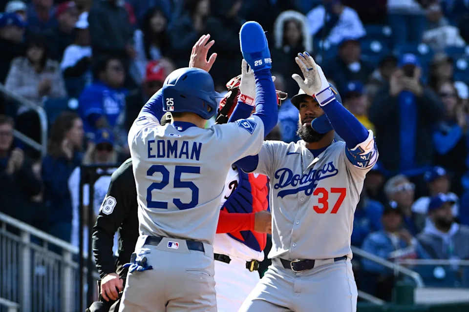 Los Angeles Dodgers outfielder Teoscar Hernández (37) is congratulated by outfielder Tommy Edman (25) after hitting a two-run home run against the Washington Nationals during the first inning at Nationals Park.Brad Mills-Imagn Images