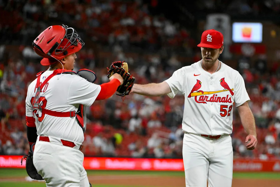Cardinals starting pitcher Matthew Liberatore (52) celebrates with catcher Yohel Pozo (63) as they walk off the field after the seventh inning against the Pittsburgh Pirates© Jeff Curry-Imagn Images