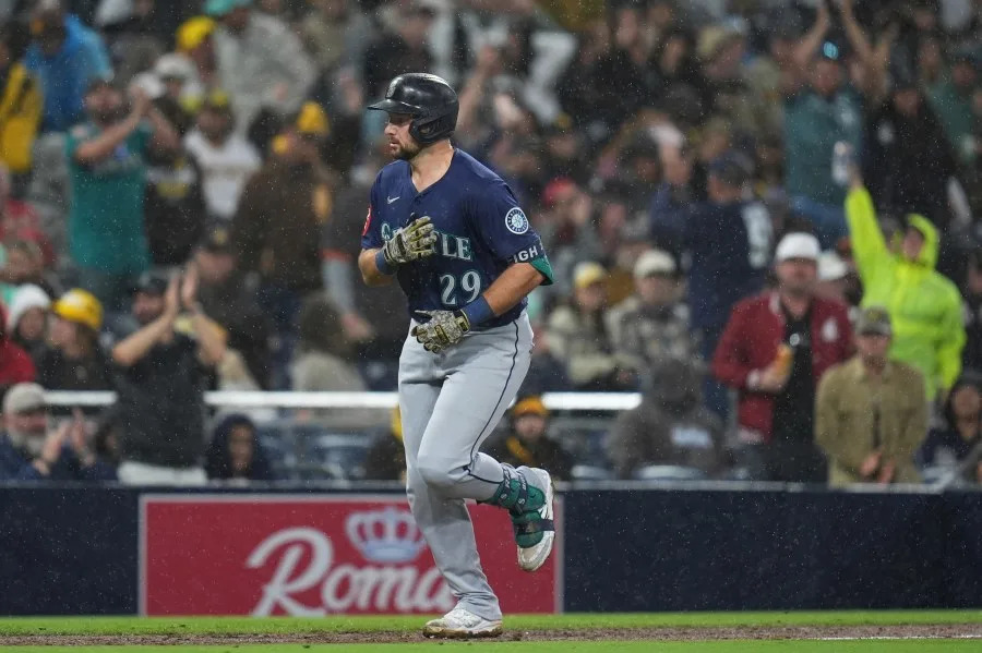 Seattle Mariners’ Cal Raleigh celebrates after hitting a home run during the seventh inning of a baseball game against the San Diego Padres Saturday, May 17, 2025, in San Diego. (AP Photo/Gregory Bull)
