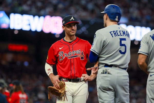Braves first baseman Matt Olson chats with Dodgers first baseman Freddie Freeman during a May 3 game at Truist Park.