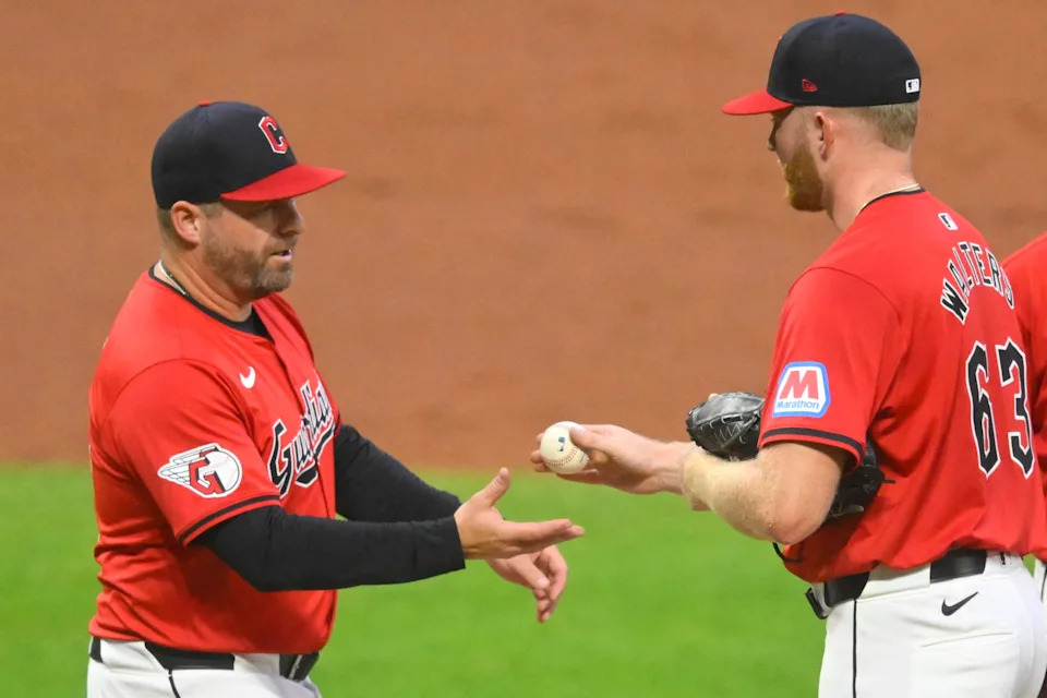 Cleveland Guardians manager Stephen Vogt takes the ball from pitcher Andrew Walters (63) during a game against the Cincinnati Reds on Sept. 25, 2024, in Cleveland, Ohio.
