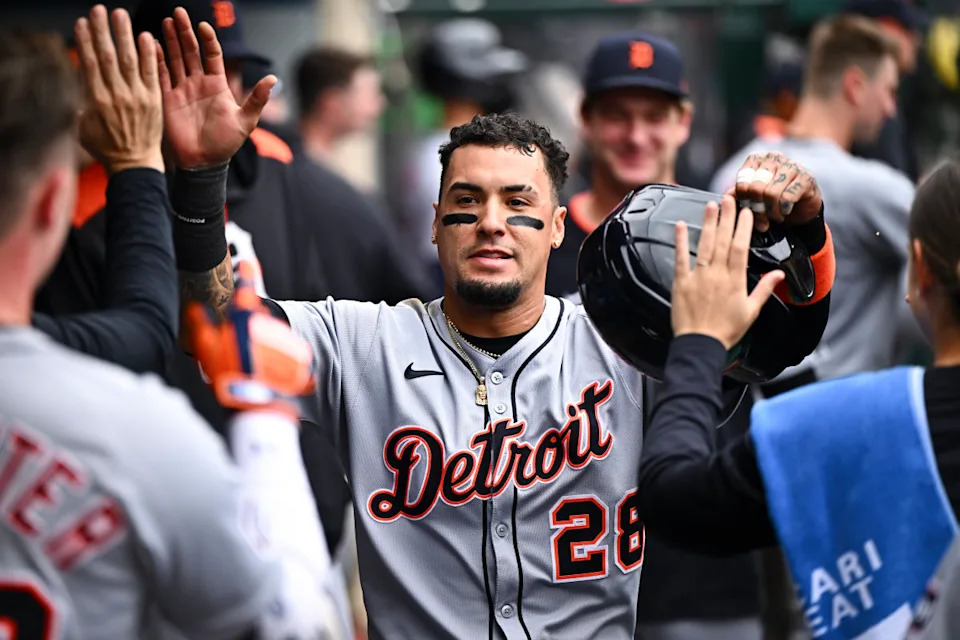 Javiez Baez gets high fives from teammates in the Tigers' dugout vs. the Red Sox on Tuesday, May 13, 2025. © Jonathan Hui-Imagn Images