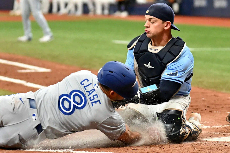 Tampa Bay Rays catcher Ben Rortvedt (30) and Toronto Blue Jays center fielder Jonatan Clase (8)© Jonathan Dyer-Imagn Images