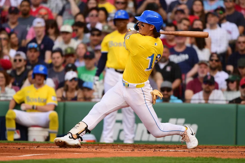 Boston Red Sox left fielder Jarren Duran (16) hits a double during the third inning against the Minnesota Twins at Fenway Park.Bob DeChiara-Imagn Images