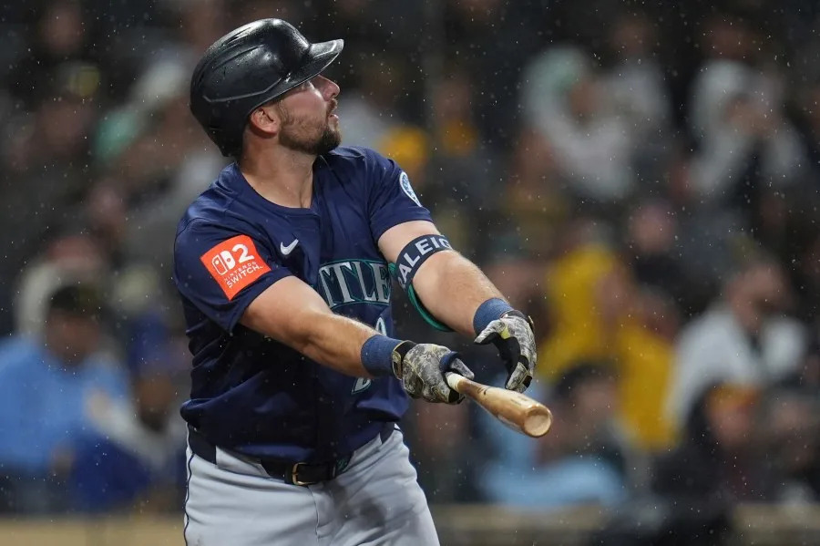 Seattle Mariners’ Cal Raleigh watches his home run during the seventh inning of a baseball game against the San Diego Padres Saturday, May 17, 2025, in San Diego. (AP Photo/Gregory Bull)