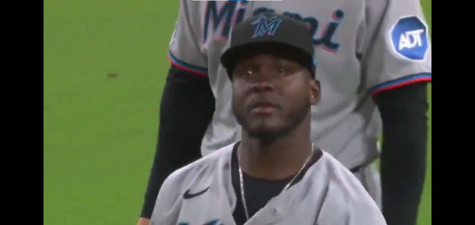 Screenshot of a baseball player in a Miami Marlins uniform appearing emotional.
