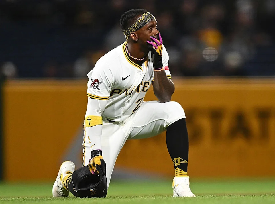 Andrew McCutchen #22 of the Pittsburgh Pirates looks on after a fan fell from the stands during the seventh inning against the Chicago Cubs