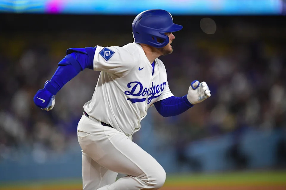 Los Angeles Dodgers third base Max Muncy (13) runs after hitting a two-run RBI at Dodger Stadium.Gary A&period; Vasquez-Imagn Images