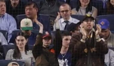 Emma Stone looked unrecognizable as she was filmed sitting directly behind home plate