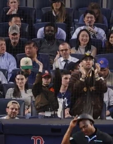 Emma Stone looked unrecognizable as she was filmed sitting directly behind home plate