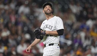 Jacob Stallings, usually a catcher, smiles as he watches one of his pitches fly over his head