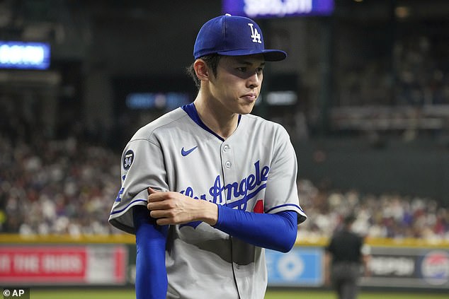 Roki Sasaki walks off the field in Phoenix after giving up five runs in four innings
