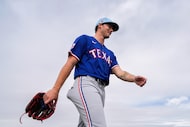 Texas Rangers pitcher Cole Winn walks from the bullpen during a spring training workout at...