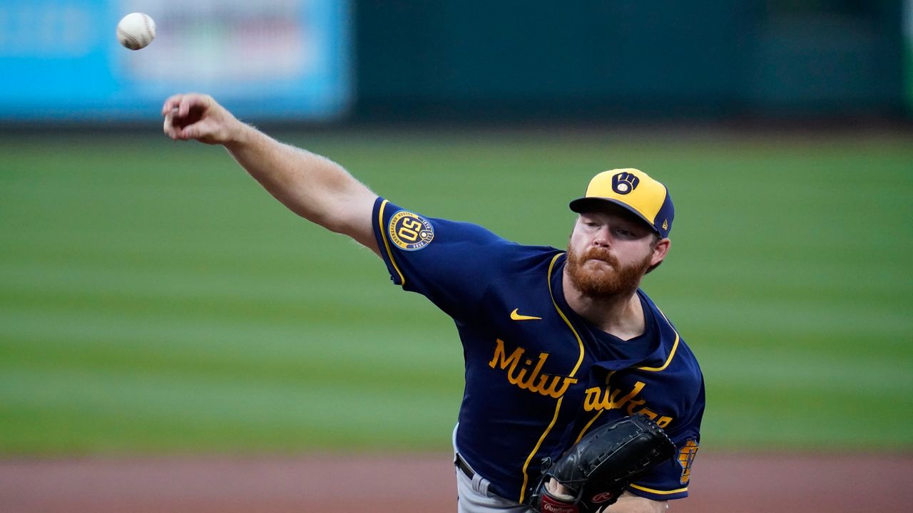 Milwaukee Brewers starting pitcher Brandon Woodruff throws during the first inning of a baseball game against the St. Louis Cardinals Saturday, Sept. 26, 2020, in St. Louis.