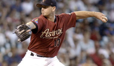 Photo of baseball player high-fiving teammates