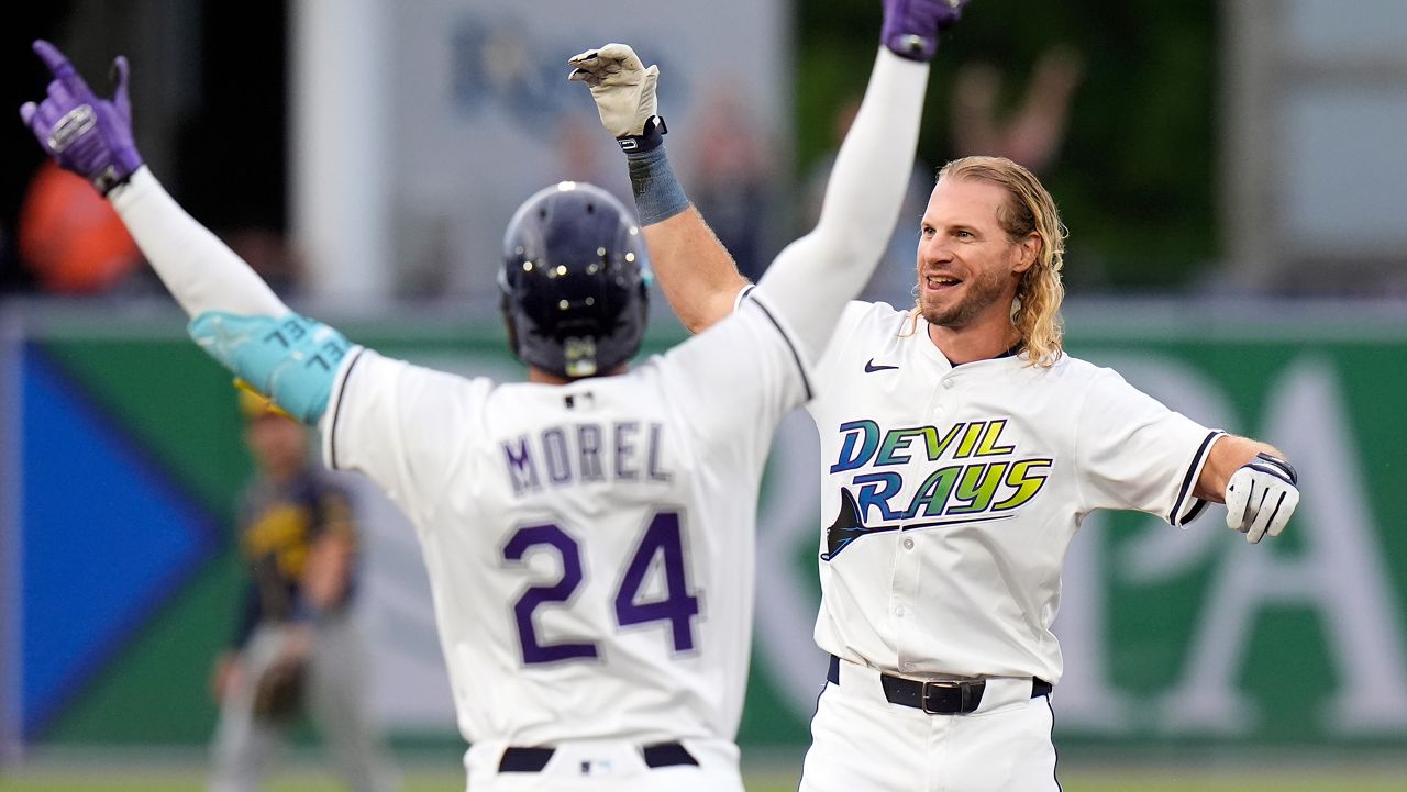 Tampa Bay Rays' Travis Jankowski celebrates with Christopher Morel (24) after Jankowski had a walkoff hit off Milwaukee Brewers pitcher Trevor Megill during the ninth inning of a baseball game Saturday, May 10, 2025, in Tampa, Fla. (AP Photo/Chris O'Meara)
