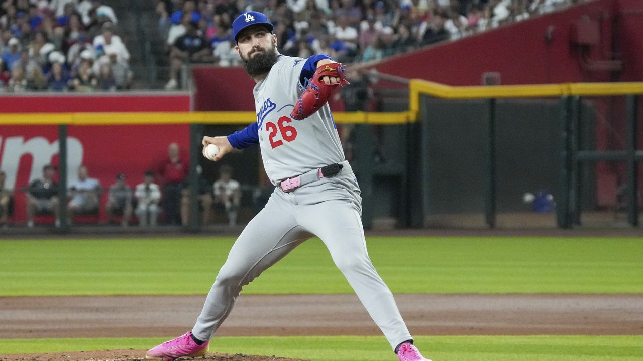 Los Angeles Dodgers pitcher Tony Gonsolin throws against the Arizona Diamondbacks during the first inning of a baseball game Sunday, May 11, 2025, in Phoenix. (AP Photo/Darryl Webb)