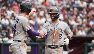 Rockies hit five homers, beat Diamondbacks 14-12 for rare road win