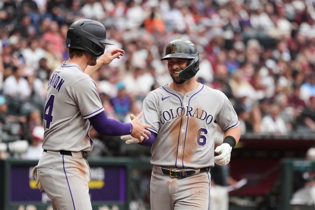Rockies hit five homers, beat Diamondbacks 14-12 for rare road win