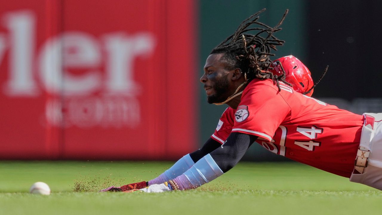 Chicago Cubs' Pete Crow-Armstrong, center, celebrates with Seiya Suzuki, left, and outfielder Kyle Tucker, right, after hitting a grand slam to right field during the seventh inning of a baseball game against the Cincinnati Reds, Friday, May 23, 2025, in Cincinnati.