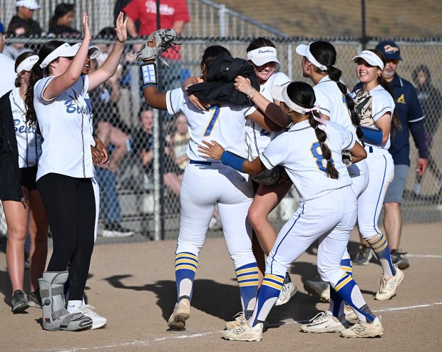 Benicia pitcher, Alana Robinson, celebrates with her team after ending the game with a strikeout in a narrow 4-3 win over Alhambra on Tuesday. (Chris Riley/Times-Herald)
