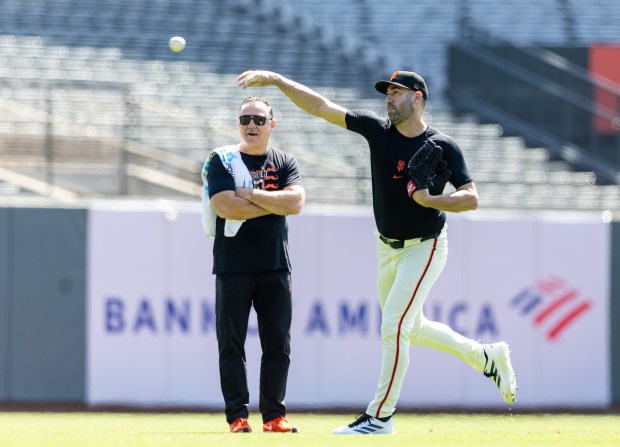 San Francisco Giants trainer Dave Groeschner watches Justin Verlander throws in the outfield, Wednesday morning, May 21, 2025, at Oracle Park in San Francisco, Calif. (Karl Mondon/Bay Area News Group)