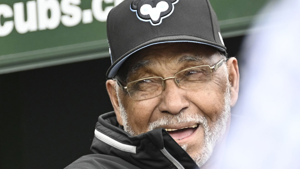 Chicago Cubs former player Billy Williams smiles while sitting in the dugout before a Cubs game against the Cincinnati Reds at Wrigley Field. 