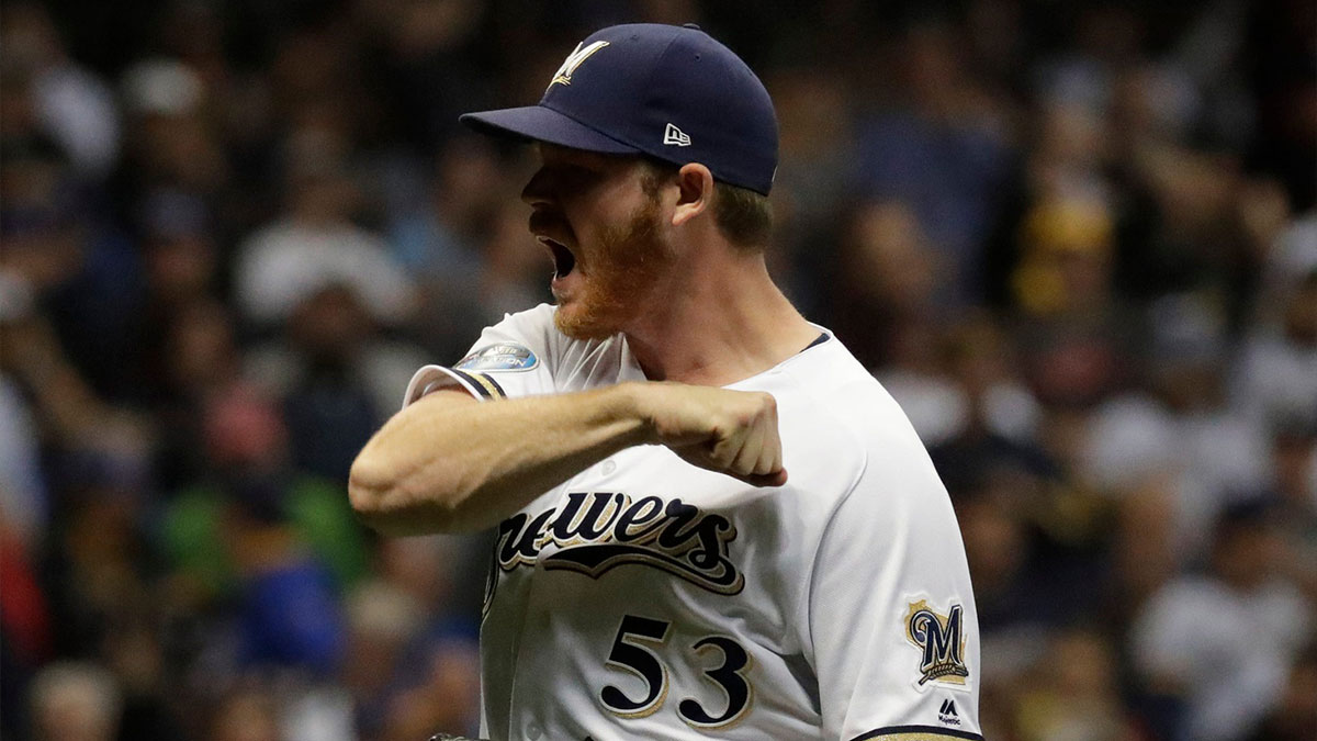 Milwaukee Brewers relief pitcher Brandon Woodruff (53) gets the crowd going after retiring the last Dodgers batter in the 9th inning.The Brewers play the Los Angeles Dodgers in Game 7 of the National League Championship Series baseball game