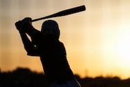 Prosper right fielder Kaden Roabardey takes a practice swing in the on deck circle during...