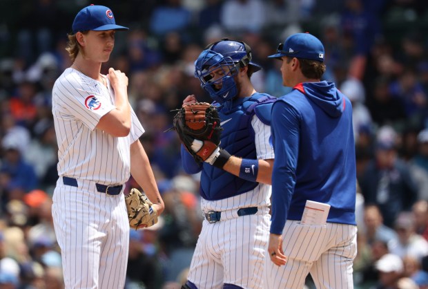 Chicago Cubs pitcher Ben Brown talks to pitching coach Tommy Hottovy in the first inning Wednesday, May 7, 2025, at Wrigley Field. (Brian Cassella/Chicago Tribune)