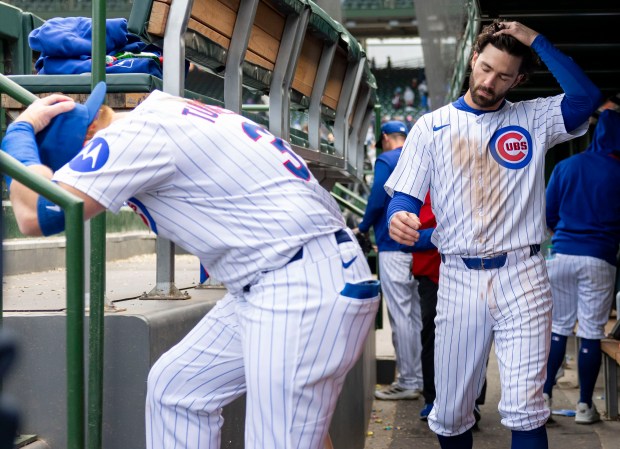 Chicago Cubs shortstop Dansby Swanson and teammate Justin Turner leave the dugout after the loss Wednesday, May 7, 2025, at Wrigley Field. (Brian Cassella/Chicago Tribune)