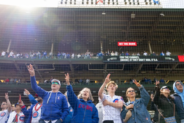 Chicago Cubs fans sing the seventh-inning stretch Wednesday, May 7, 2025, at Wrigley Field. (Brian Cassella/Chicago Tribune)
