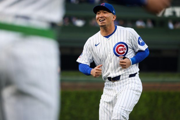 Chicago Cubs outfielder Seiya Suzuki (27) warms up for a game against the Colorado Rockies on Wednesday, May 28, 2025, at Wrigley Field. (Audrey Richardson/Chicago Tribune)