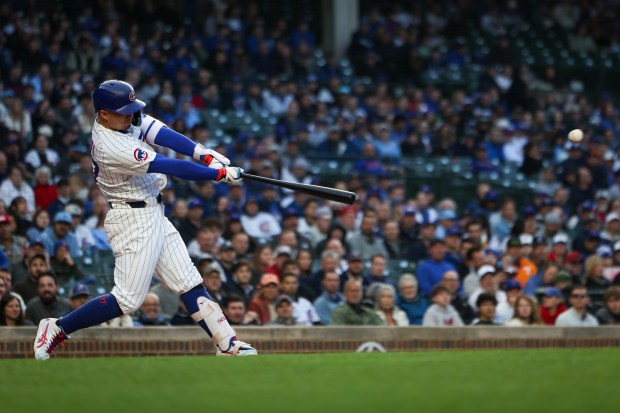 Cubs designated hitter Seiya Suzuki hits an RBI double to drive in Kyle Tucker during the first inning against the Rockies on May 28, 2025, at Wrigley Field. (Audrey Richardson/Chicago Tribune)