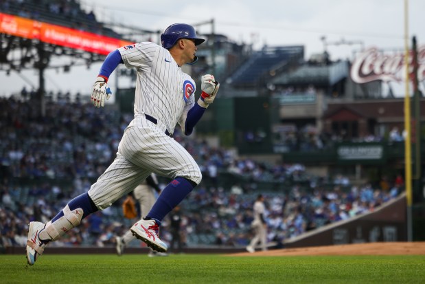 Cubs designated hitter Seiya Suzuki rounds first base on his RBI double during the first inning against the Rockies on May 28, 2025, at Wrigley Field. (Audrey Richardson/Chicago Tribune)
