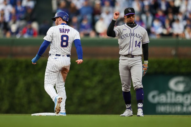 Cubs left fielder Ian Happ is forced out at second base by Rockies shortstop Ezequiel Tovar during the first inning on May 28, 2025, at Wrigley Field. (Audrey Richardson/Chicago Tribune)