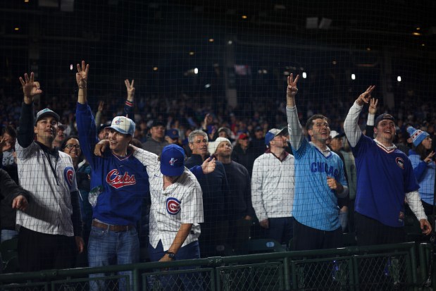 Cubs fans sing "Take Me Out to the Ball Game" during a game against the Rockies on May 28, 2025, at Wrigley Field. (Audrey Richardson/Chicago Tribune)