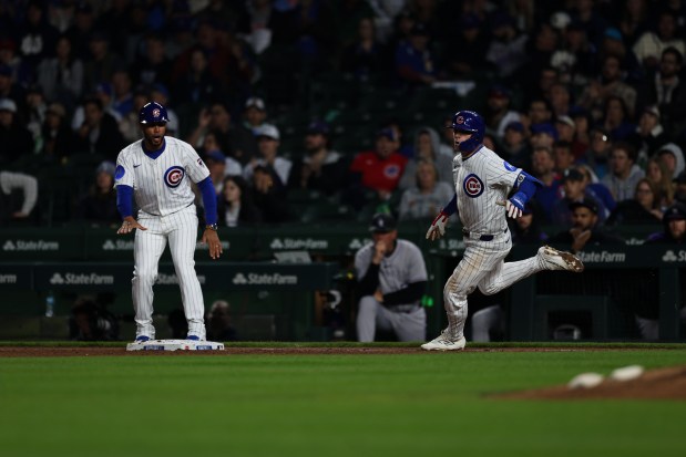 Cubs third baseman Matt Shaw heads to first after singling on a line drive to left field during the fifth inning against the Rockies on May 28, 2025, at Wrigley Field. (Audrey Richardson/Chicago Tribune)