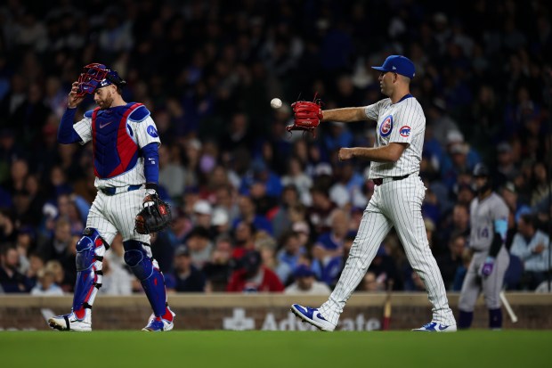 Cubs starter Matthew Boyd and catcher Carson Kelly head to the mound after Boyd's throwing error on a pickoff attempt during the sixth inning against the Rockies on May 28, 2025, at Wrigley Field. (Audrey Richardson/Chicago Tribune)