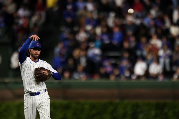 Cubs shortstop Dansby Swanson throws to first to retire Rockies designated hitter Orlando Arcia during the eighth inning on May 28, 2025, at Wrigley Field. (Audrey Richardson/Chicago Tribune)