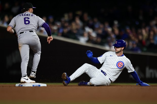 Cubs right fielder Kyle Tucker is forced out at second base on a double play during the eighth inning against the Rockies on May 28, 2025,at Wrigley Field. (Audrey Richardson/Chicago Tribune)