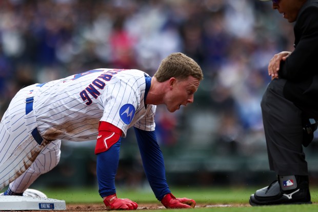 Chicago Cubs outfielder Pete Crow-Armstrong (4) slides into third base safely after hitting a triple in the first inning against the Chicago White Sox at Wrigley Field on Sunday, May 18, 2025. (Eileen T. Meslar/Chicago Tribune)