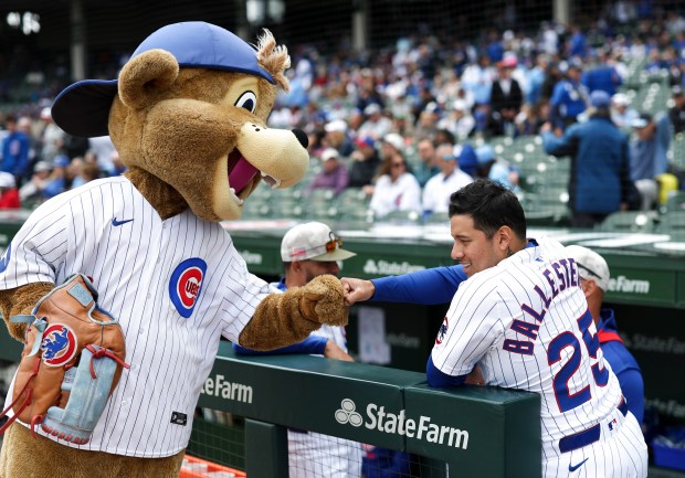 Clark fist bumps Chicago Cubs catcher Moisés Ballesteros (25) before the Chicago Cubs game against the Chicago White Sox at Wrigley Field on Sunday, May 18, 2025. (Eileen T. Meslar/Chicago Tribune)