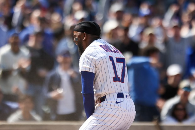 Chicago Cubs third baseman Vidal Bruján (17) celebrates sliding safely into home after an RBI double by outfielder Pete Crow-Armstrong (4) in the sixth inning against the Chicago White Sox at Wrigley Field on Sunday, May 18, 2025. (Eileen T. Meslar/Chicago Tribune)