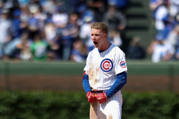 Chicago Cubs outfielder Pete Crow-Armstrong (4) celebrates after he hit an RBI double to score third baseman Vidal Bruján (17) in the sixth inning against the Chicago White Sox at Wrigley Field on Sunday, May 18, 2025. (Eileen T. Meslar/Chicago Tribune)