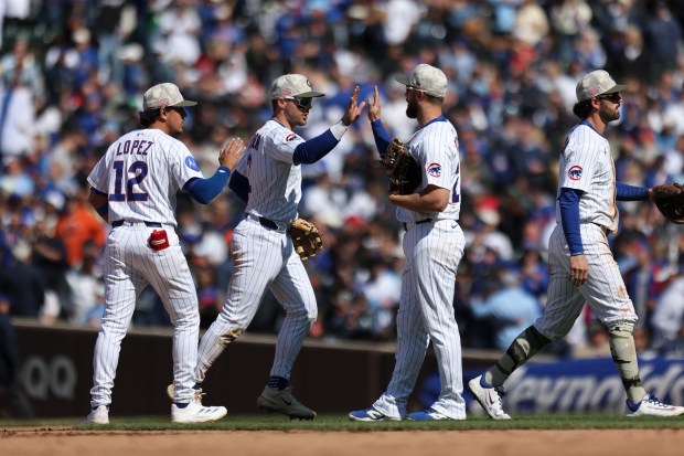 Chicago Cubs players celebrate after they defeated the Chicago White Sox 6-2 at Wrigley Field on Sunday, May 18, 2025. (Eileen T. Meslar/Chicago Tribune)