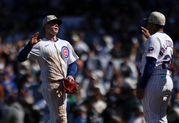 Chicago Cubs outfielder Pete Crow-Armstrong (4) high-fives catcher Moisés Ballesteros (25) after they defeated the Chicago White Sox 6-2 at Wrigley Field on Sunday, May 18, 2025. (Eileen T. Meslar/Chicago Tribune)