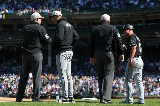 Chicago White Sox manager Will Venable (1) speaks to an umpire after Chicago White Sox third base/infield coach Justin Jirschele (17) got into an argument with the umpire in the ninth inning against the Chicago Cubs at Wrigley Field on Sunday, May 18, 2025. (Eileen T. Meslar/Chicago Tribune)